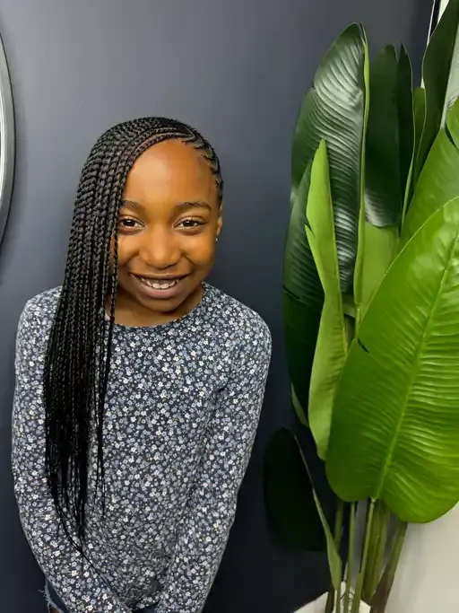 Kids braids with clean parts and gentle tension.