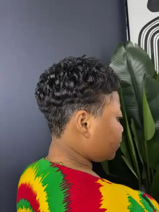 Ladies pixie cut with a sleek, polished finish.