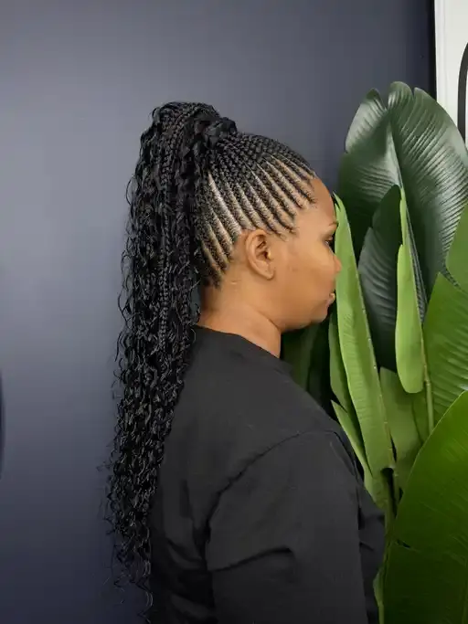 High ponytail braids with smooth edges.